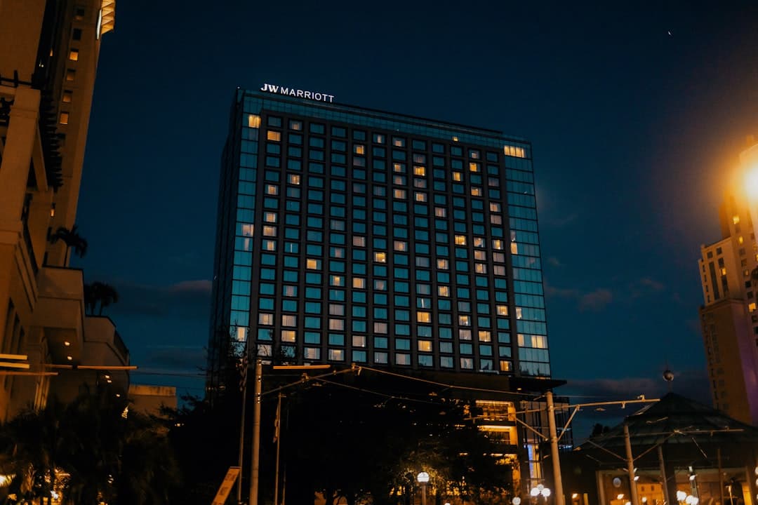 a very tall building lit up at night — Photo by Jordan Ryskamp on Unsplash