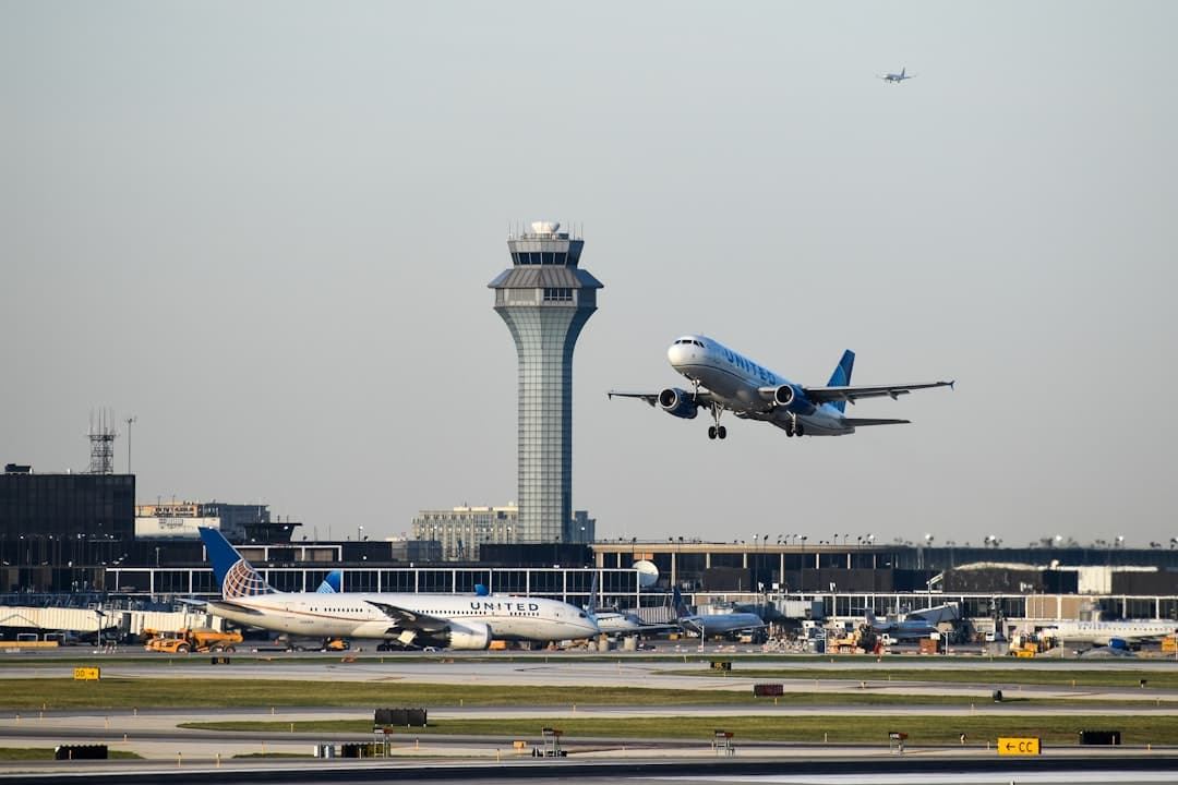 an airplane taking off from an airport runway — Photo by David Syphers on Unsplash