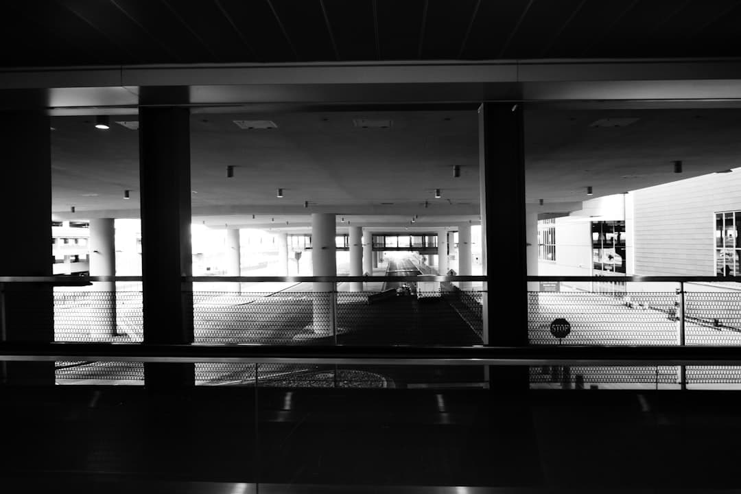 A black and white view of an interior space. — Photo by Mandy Bourke on Unsplash