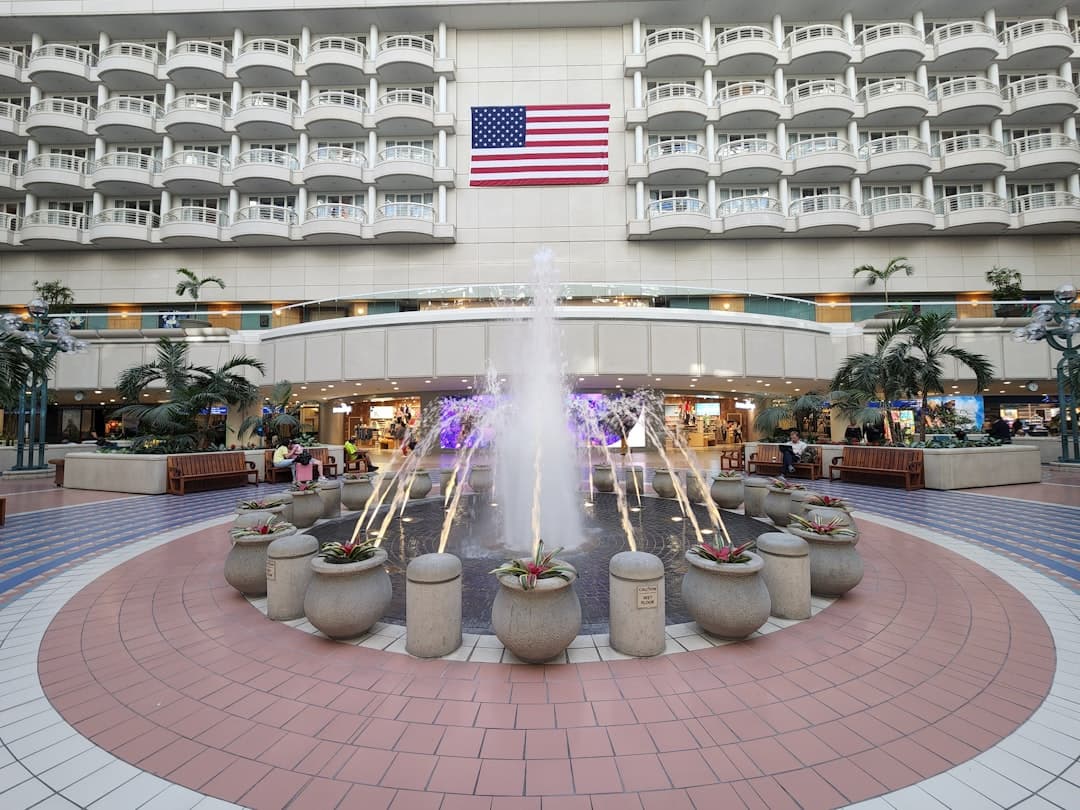 a fountain in front of a building — Photo by Kenny Xie on Unsplash