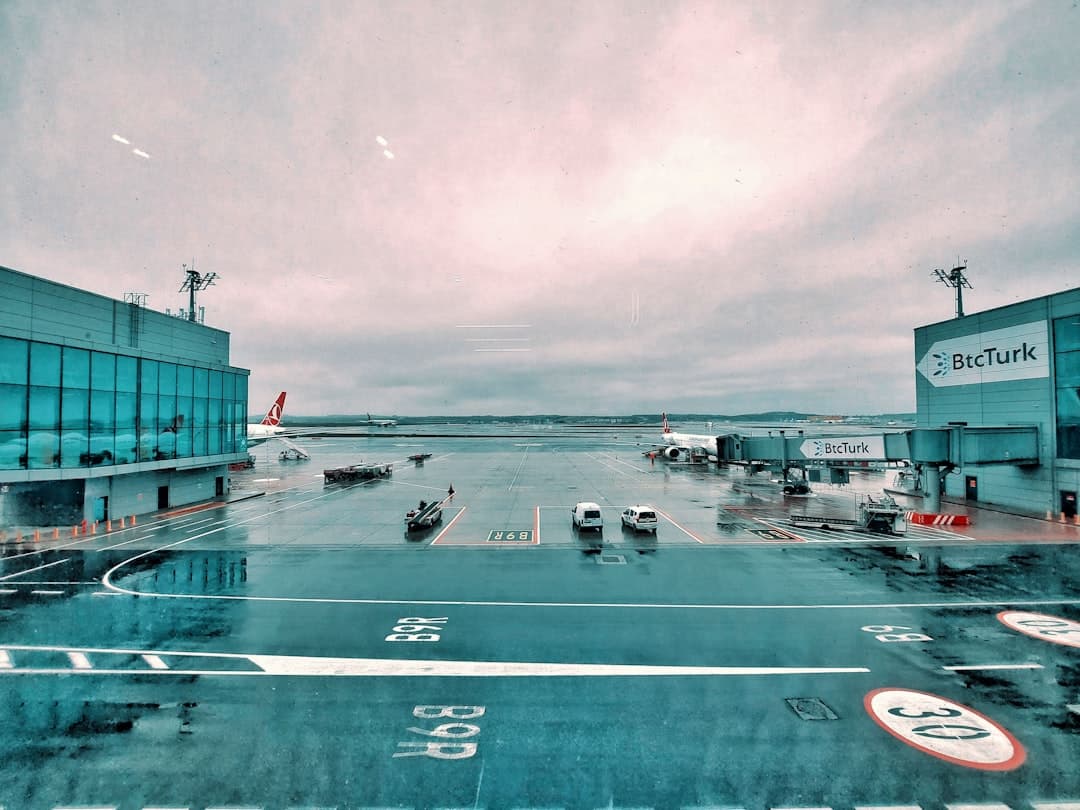 an airport with a plane parked on the tarmac — Photo by Ganda Lukman on Unsplash