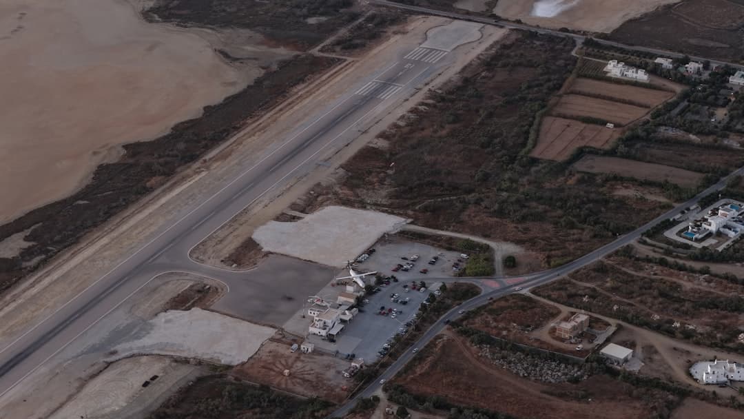 Aerial view of a small airport with planes on tarmac. — Photo by MAVIC 101 on Unsplash