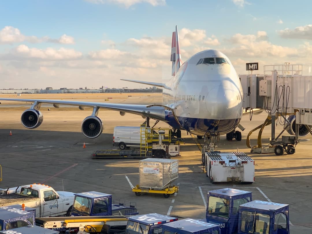 white airliner on tarmack — Photo by Patrick Campanale on Unsplash