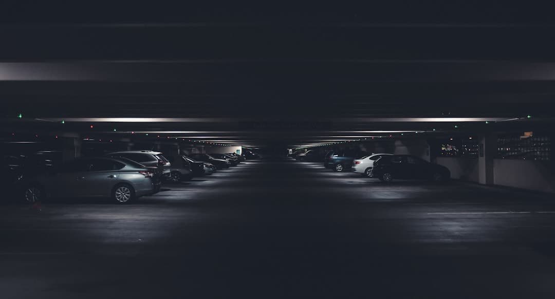 car under building — Photo by Quilia on Unsplash