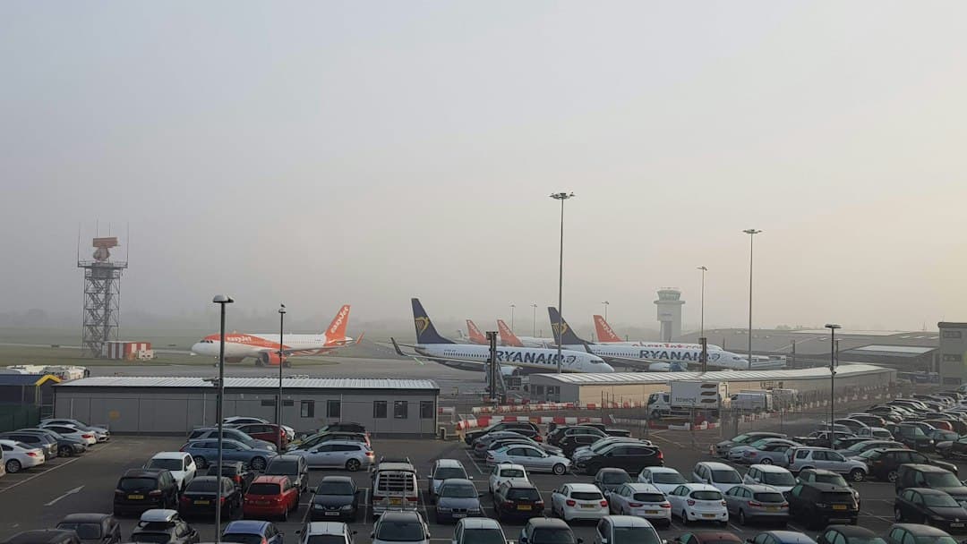 vehicle parked in airport during daytime — Photo by Elizabeth Jamieson on Unsplash