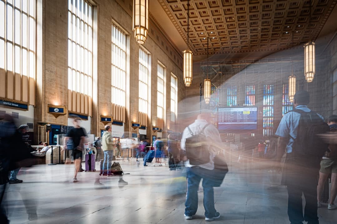 A blurry photo of people standing in a train station — Photo by Nils Huenerfuerst on Unsplash