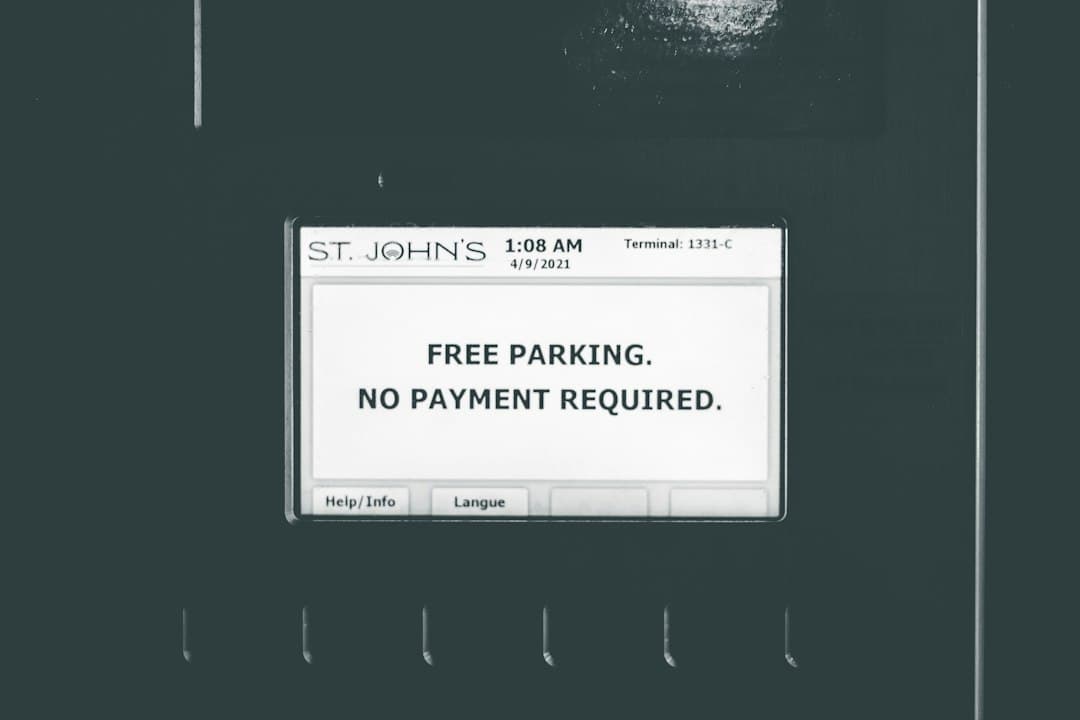 a black and white photo of a parking sign — Photo by Erik Mclean on Unsplash