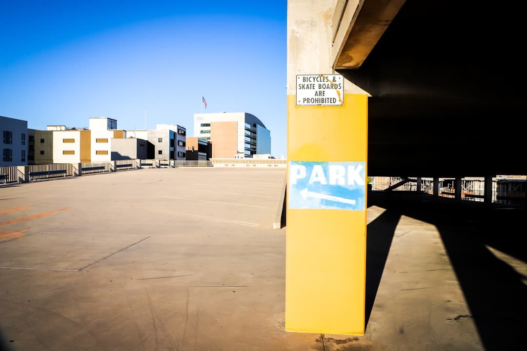yellow and white post near white and brown building during daytime — Photo by Frankie Lopez on Unsplash