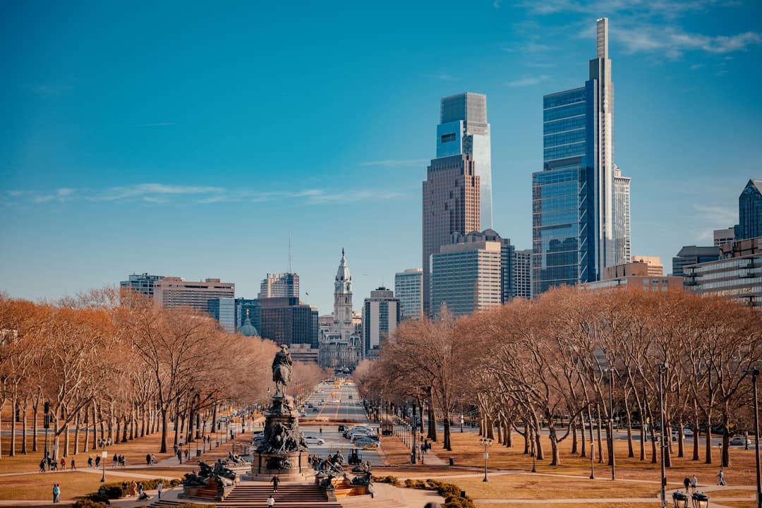 a view of a city with tall buildings in the background — Photo by Y M on Unsplash