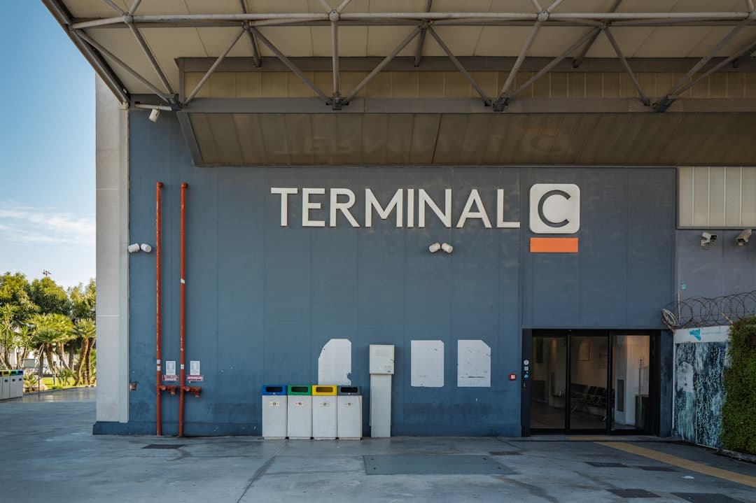 Terminal c entrance with recycling bins — Photo by Alexander Schimmeck on Unsplash