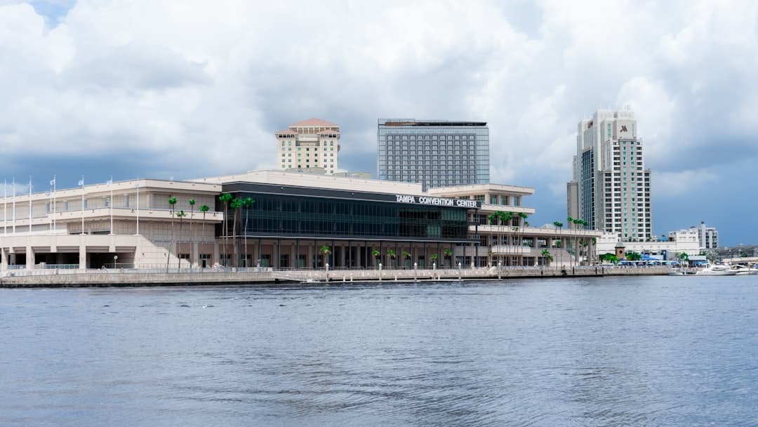 a large building sitting on the side of a body of water — Photo by James Maynard Jr on Unsplash