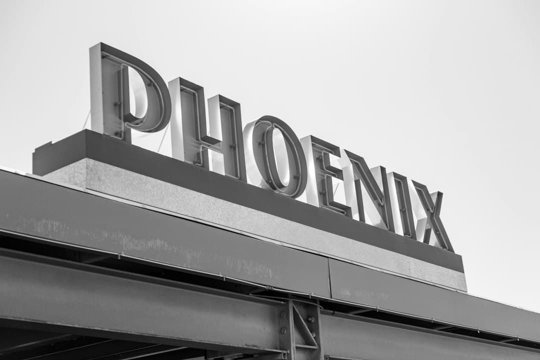 a black and white photo of a sign for a store — Photo by Ian Dziuk on Unsplash