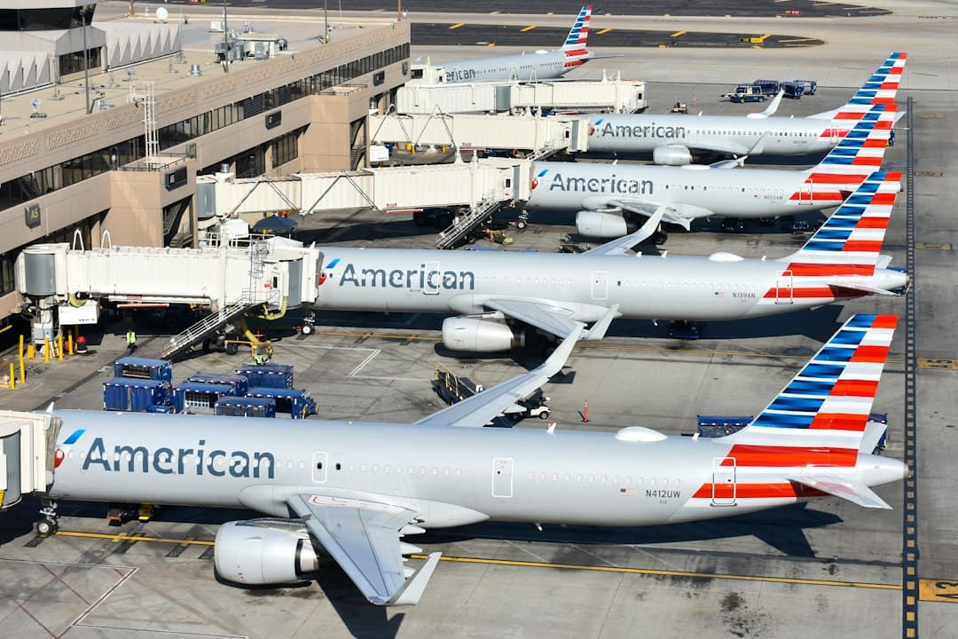 A group of american airlines planes parked at an airport — Photo by David Syphers on Unsplash