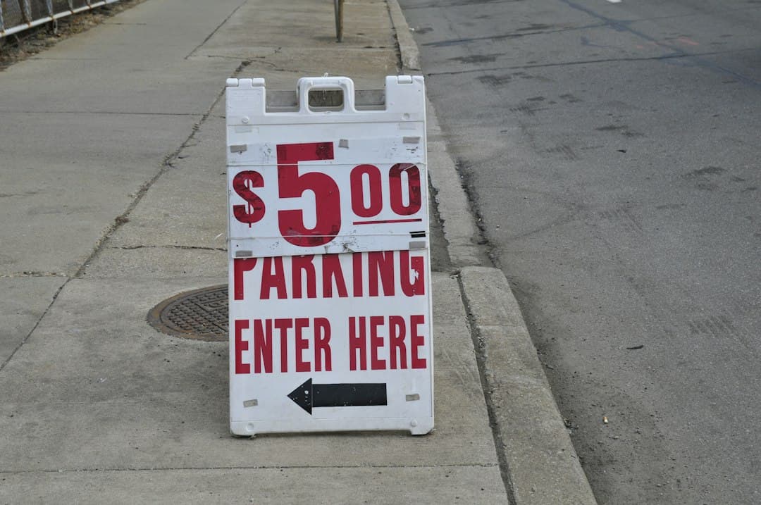 white and red no parking sign — Photo by Odd Fellow on Unsplash