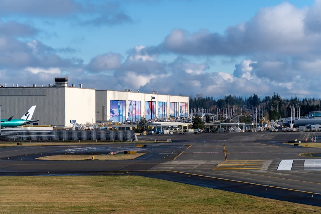 An airport with several planes parked on the tarmac — Photo by Nils Huenerfuerst on Unsplash