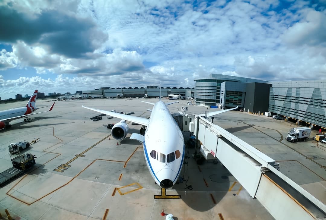 white airplane at airport during daytime — Photo by Andrés Dallimonti on Unsplash