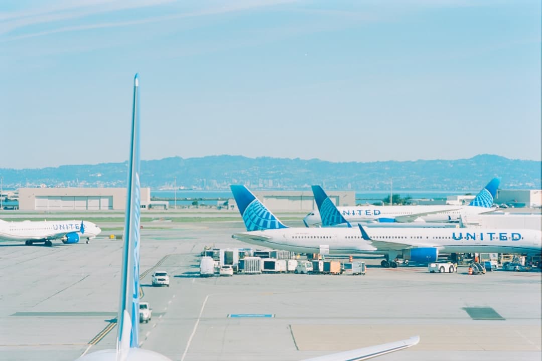 Several united airplanes are parked at an airport. — Photo by realfish on Unsplash