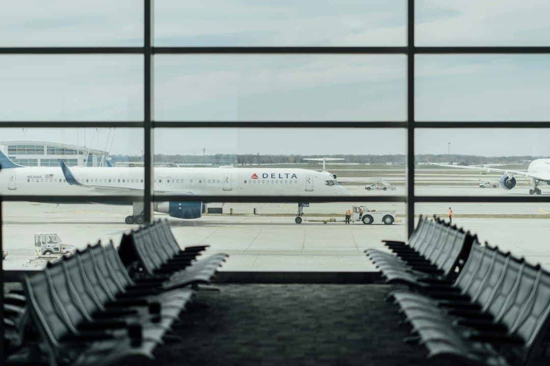 blue and white Delta airplane — Photo by Hanson Lu on Unsplash