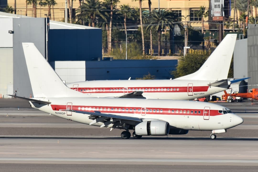 A large jetliner sitting on top of an airport tarmac — Photo by David Syphers on Unsplash