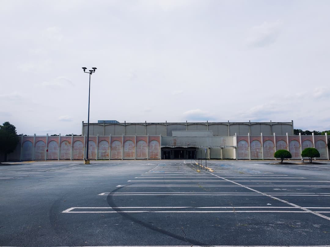 a large building with a parking lot — Photo by Casey Lovegrove on Unsplash