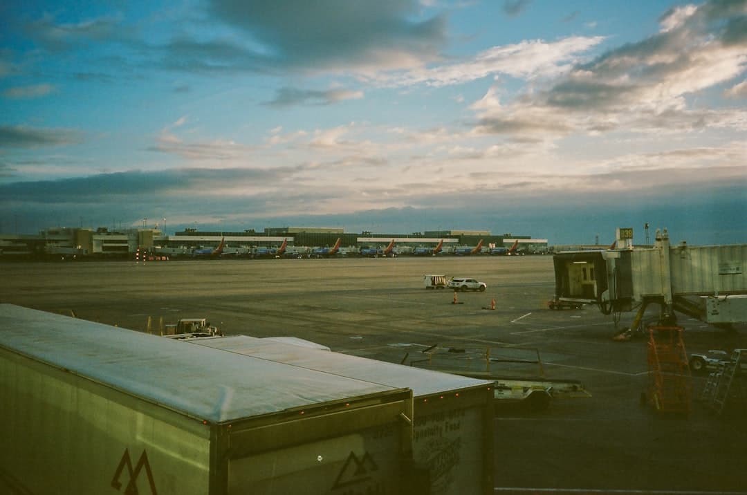 a view of an airport from a window — Photo by Tyler on Unsplash