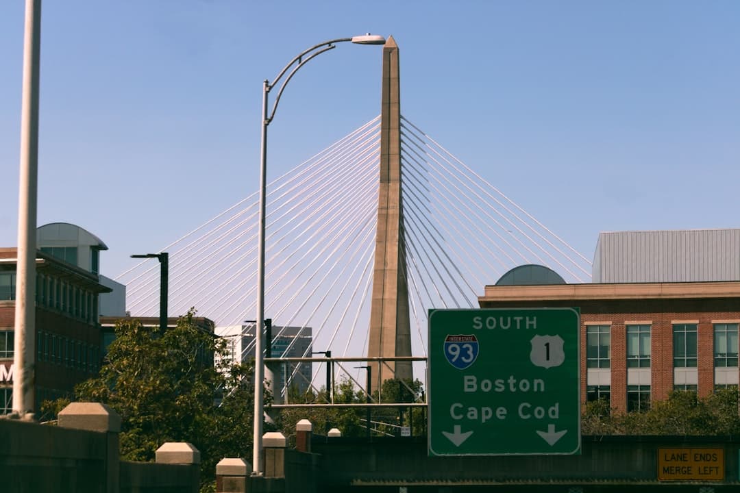 a street sign on the side of a bridge — Photo by Yaakov Winiarz on Unsplash