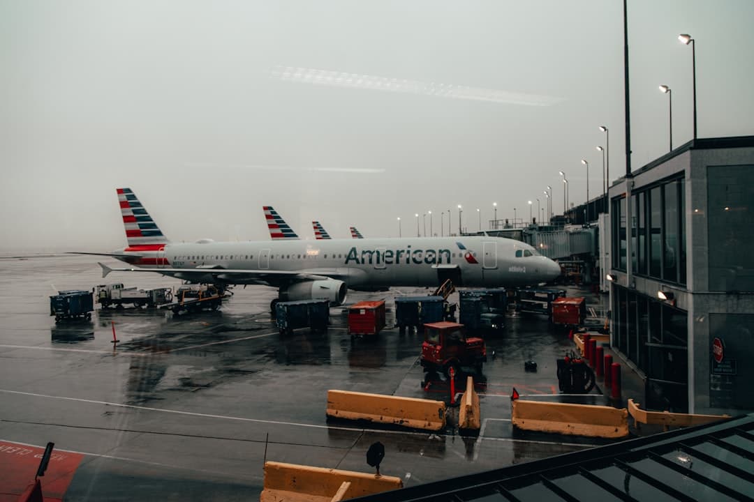 people standing near white and red airplane during daytime — Photo by Joshua Hanson on Unsplash