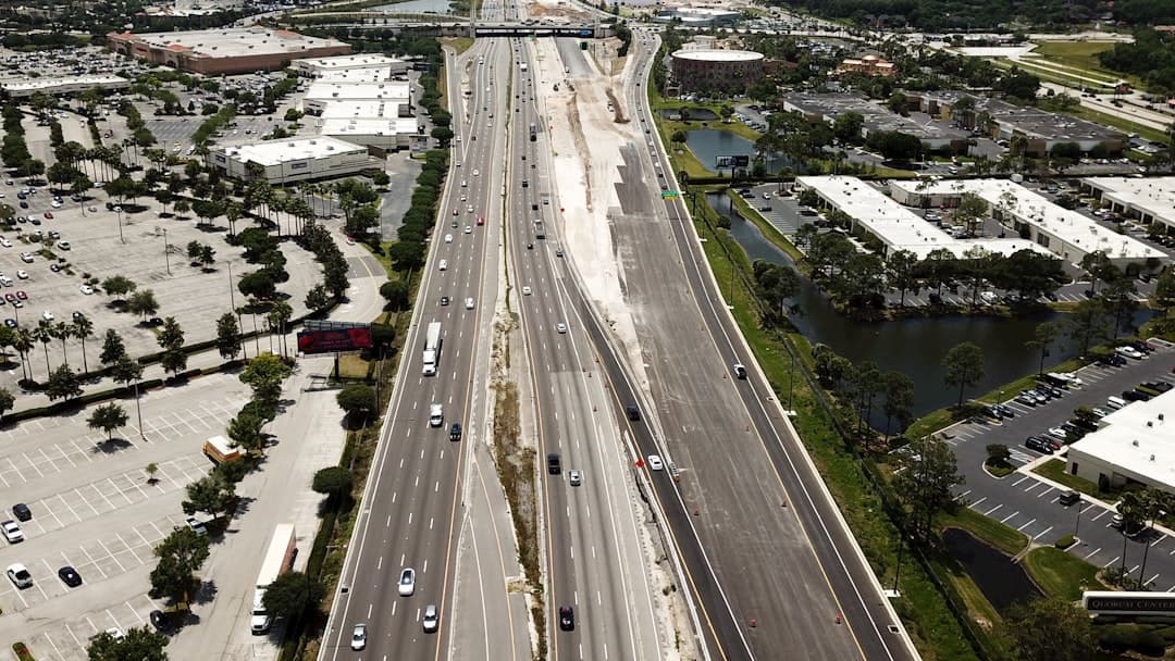an aerial view of a highway and a city — Photo by Freysteinn G. Jonsson on Unsplash