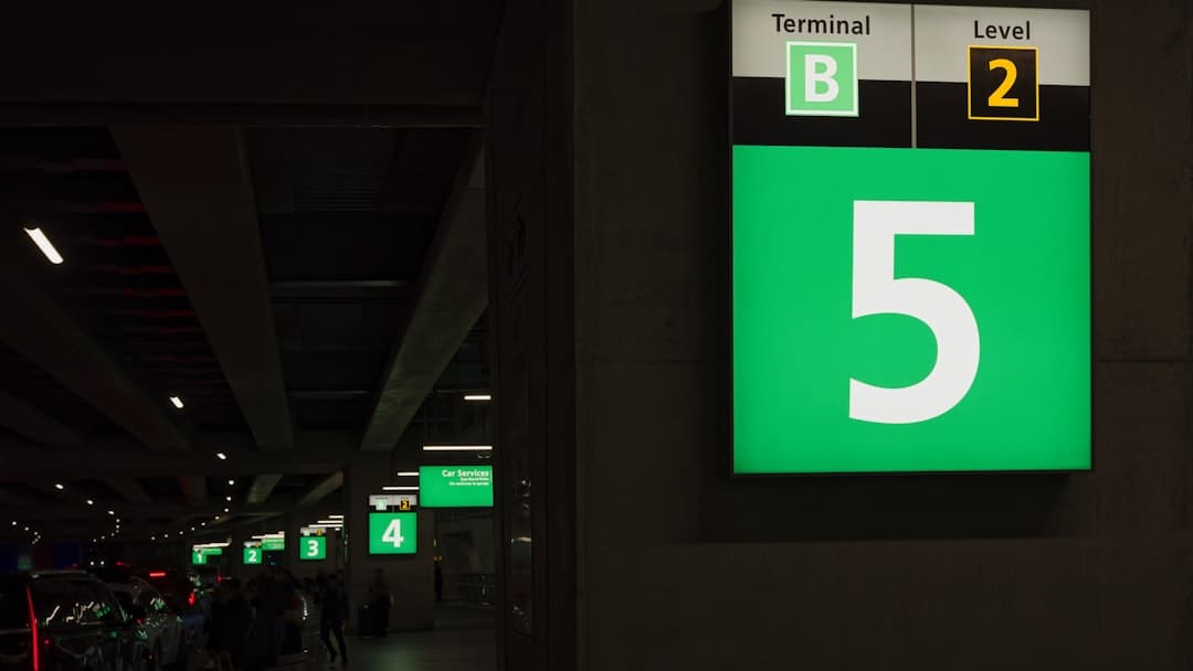 a green and white sign that says terminal level 5 — Photo by Eric Prouzet on Unsplash