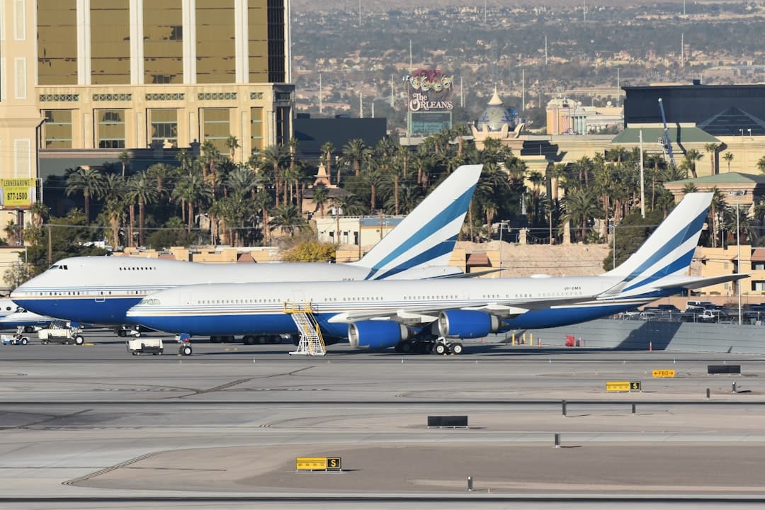 A couple of airplanes that are on a runway — Photo by David Syphers on Unsplash