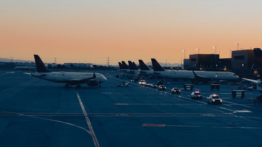 A group of airplanes parked on a runway — Photo by Haomeng Yang on Unsplash