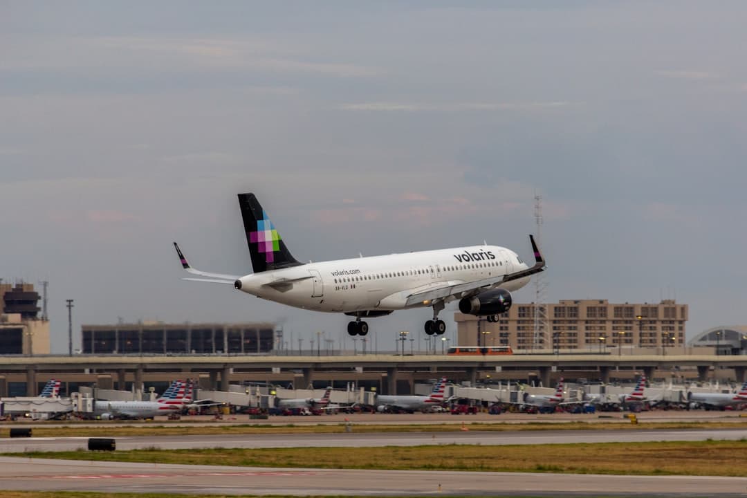 A large jetliner taking off from an airport runway — Photo by Izyan Sultanali on Unsplash