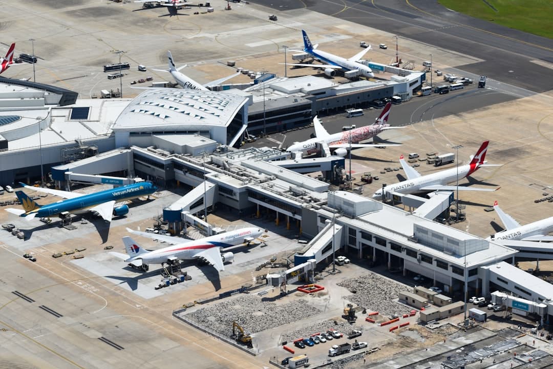 an aerial view of an airport with many planes — Photo by David Syphers on Unsplash