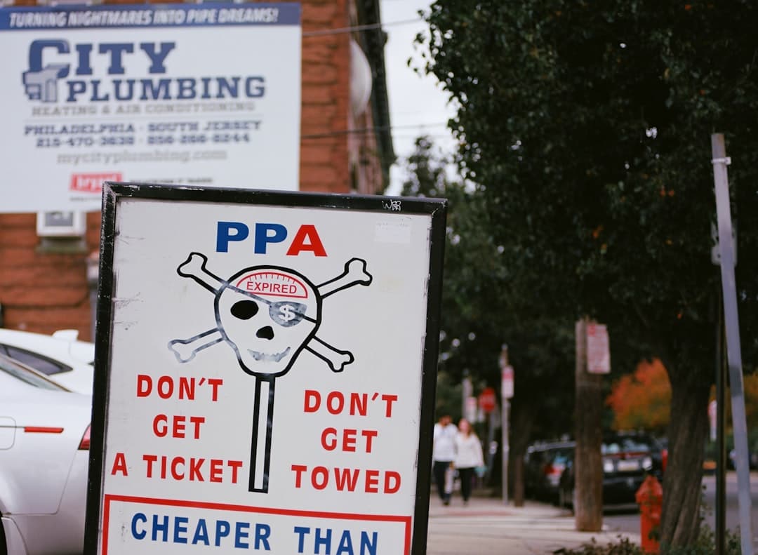 a sign on the side of the road that says, don't get a — Photo by Tyler Menezes on Unsplash