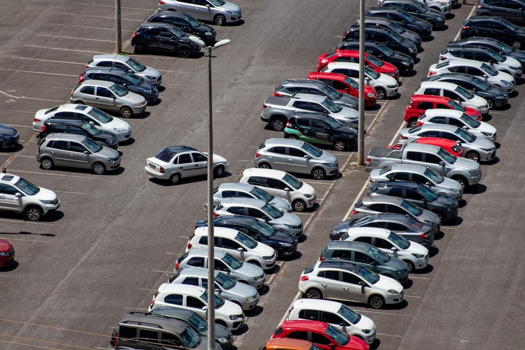 cars parked on parking lot during daytime — Photo by Vitor Paladini on Unsplash