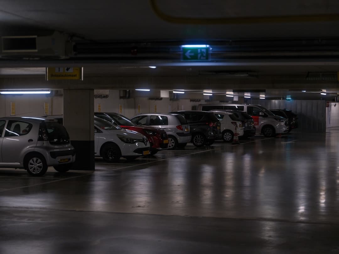 Cars parked in a dimly lit underground garage. — Photo by Haberdoedas on Unsplash