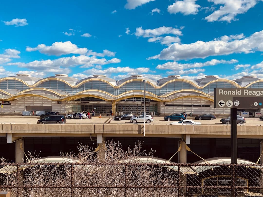 cars are parked in front of a terminal — Photo by Taylor Friehl on Unsplash