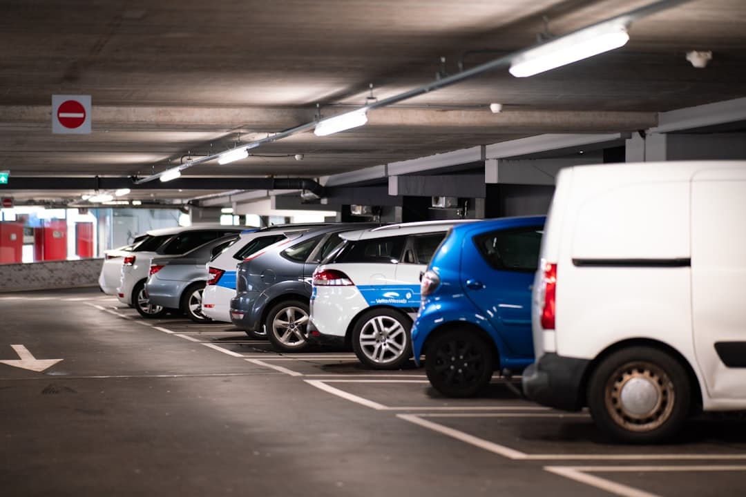 cars parked in parking lot — Photo by Michael Fousert on Unsplash