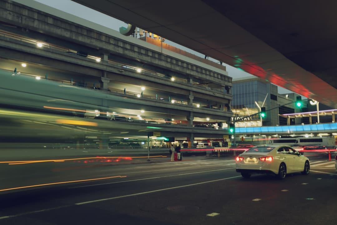 City street scene with fast motion and a car. — Photo by Looka Chow on Unsplash