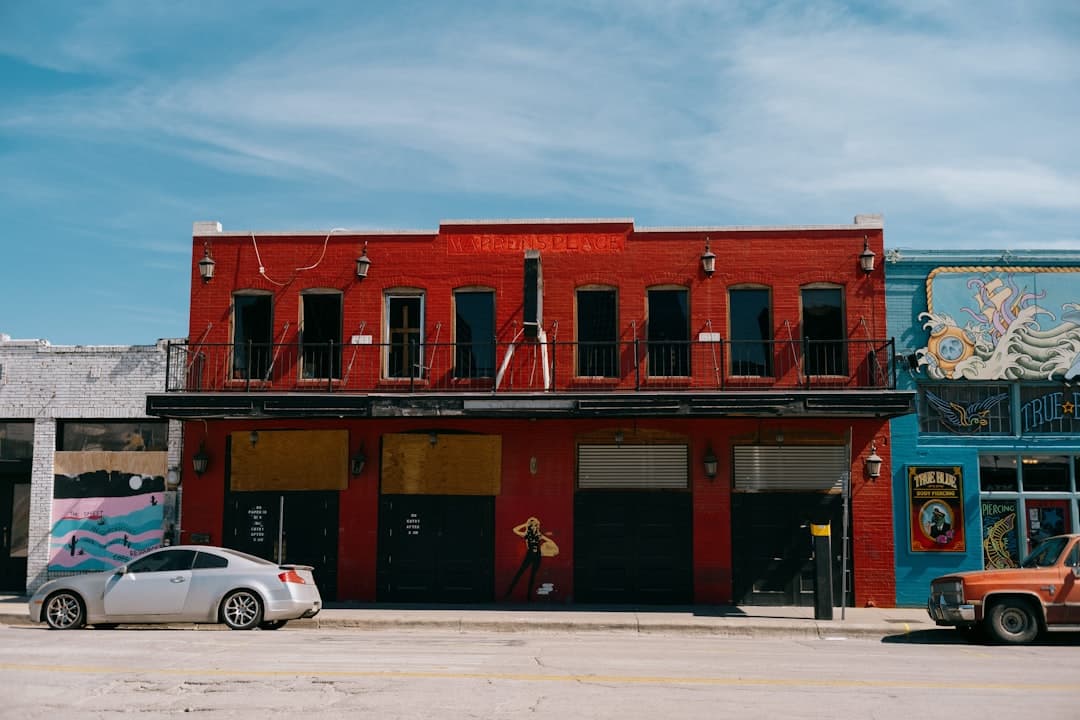 a car is parked in front of a building — Photo by Francisco Gonzalez on Unsplash