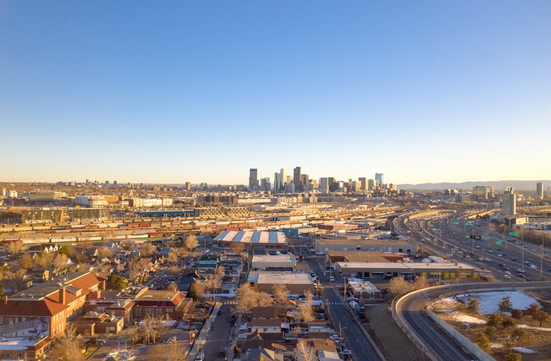 City skyline and surrounding structures are seen. — Photo by Eric Dahm on Unsplash
