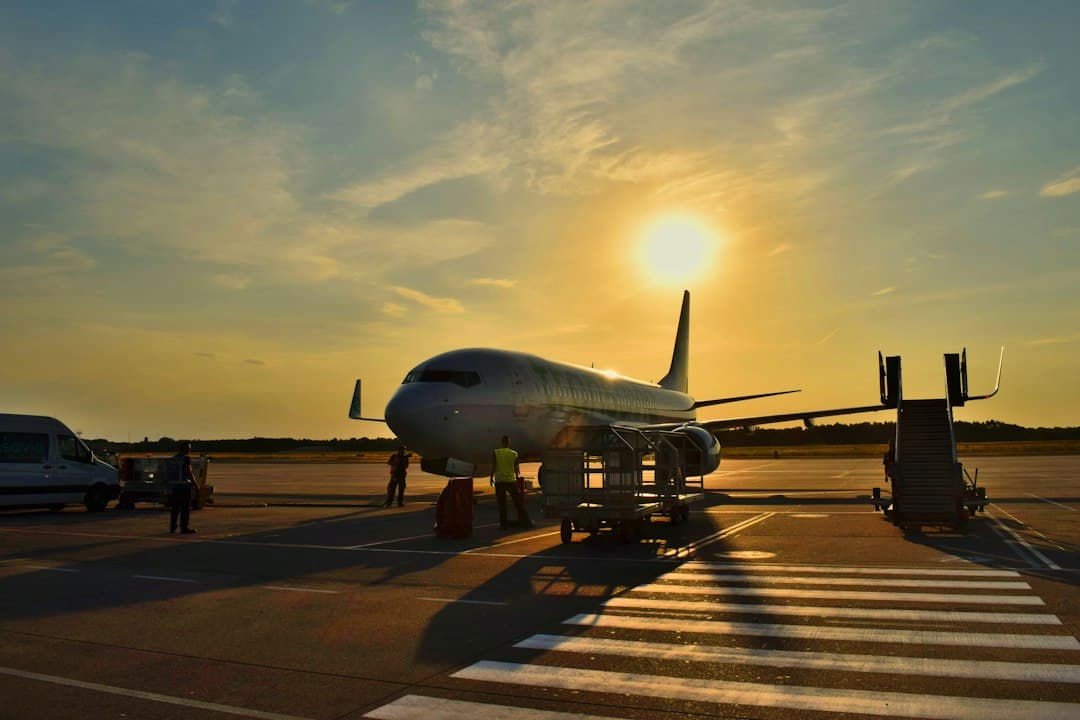 white airplane parked during daytime — Photo by Anna Gru on Unsplash