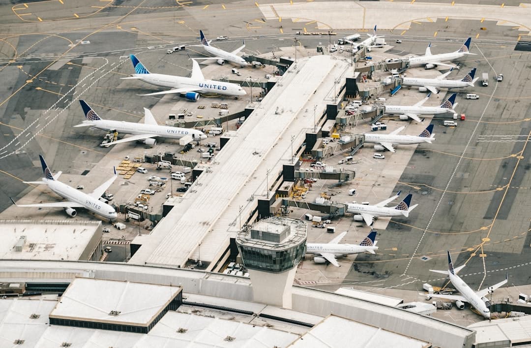 white and gray airplane on airport during daytime — Photo by Chris Leipelt on Unsplash