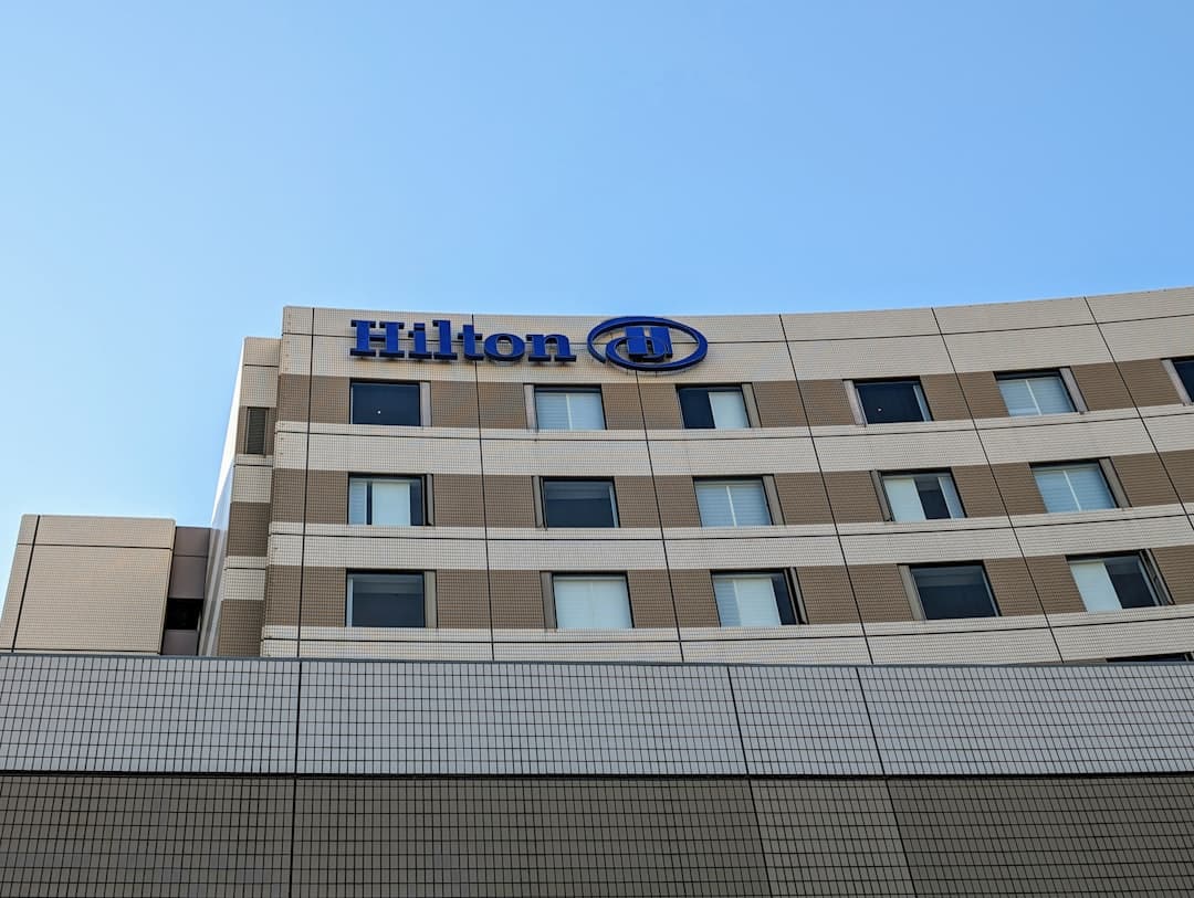 a building with a sign on top of it — Photo by Kenjiro Yagi on Unsplash