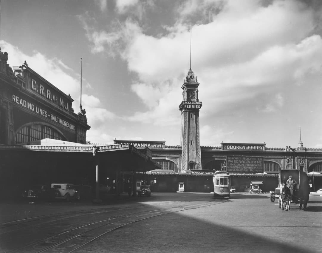 Historic train station with clock tower and streetcar — Photo by The New York Public Library on Unsplash