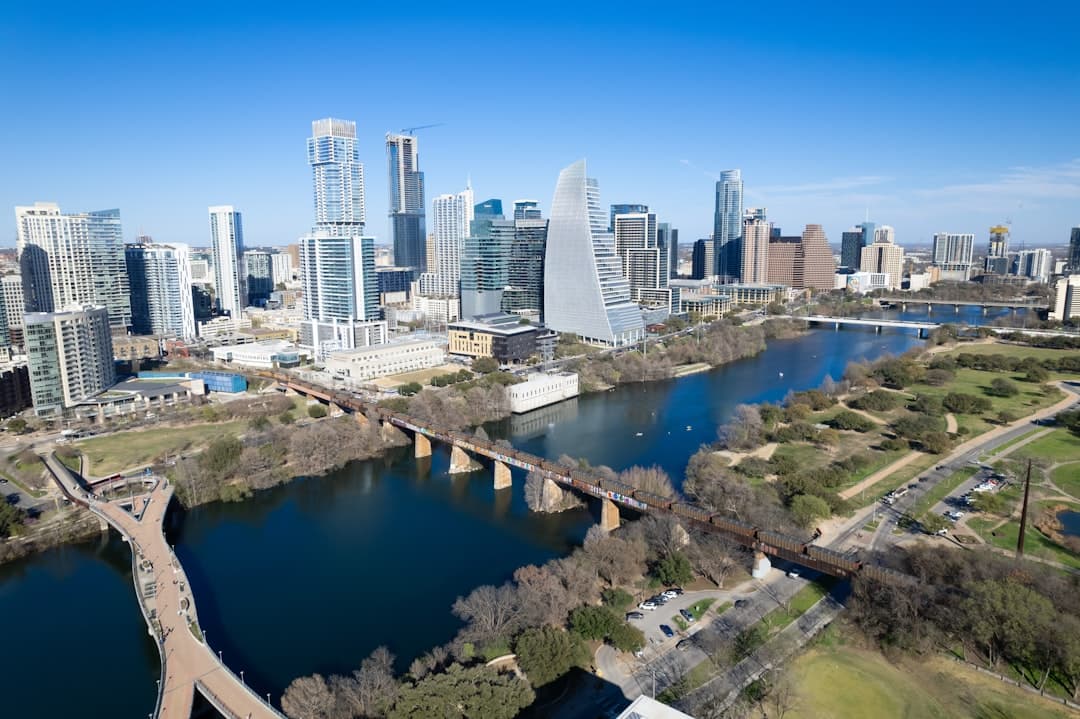an aerial view of a city and a river — Photo by Drone Doggy on Unsplash