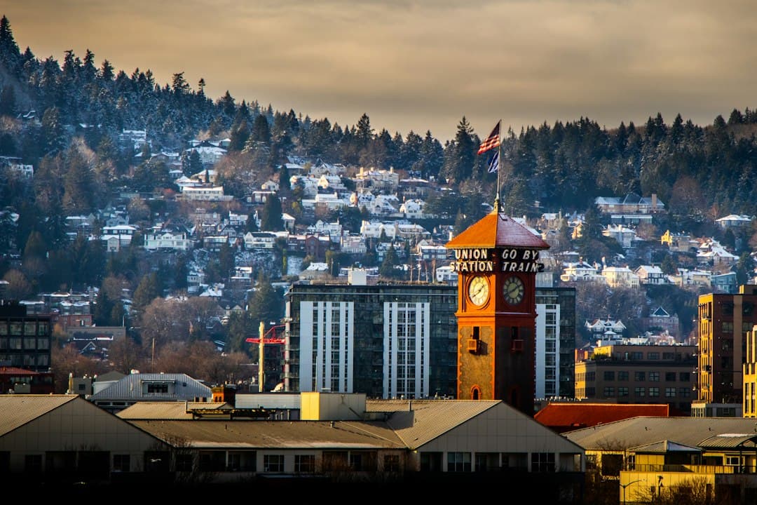 a clock tower in the middle of a city — Photo by Jimmy Hu on Unsplash