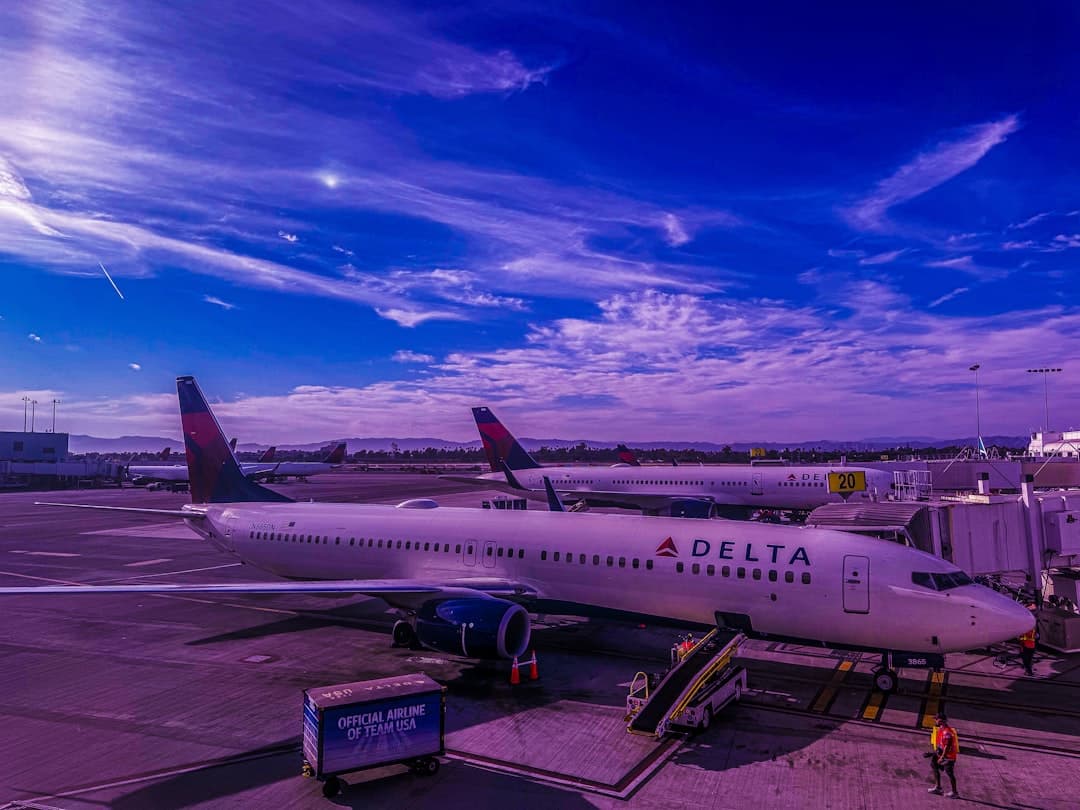 A large jetliner sitting on top of an airport tarmac — Photo by Michael Evans on Unsplash