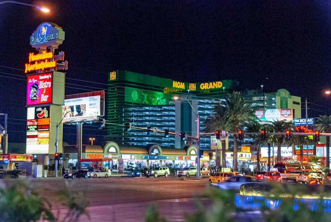 cars parked near the building during night time — Photo by David Vives on Unsplash