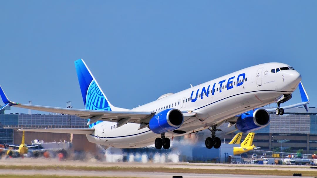 a large jetliner taking off from an airport runway — Photo by Henry Siismets on Unsplash